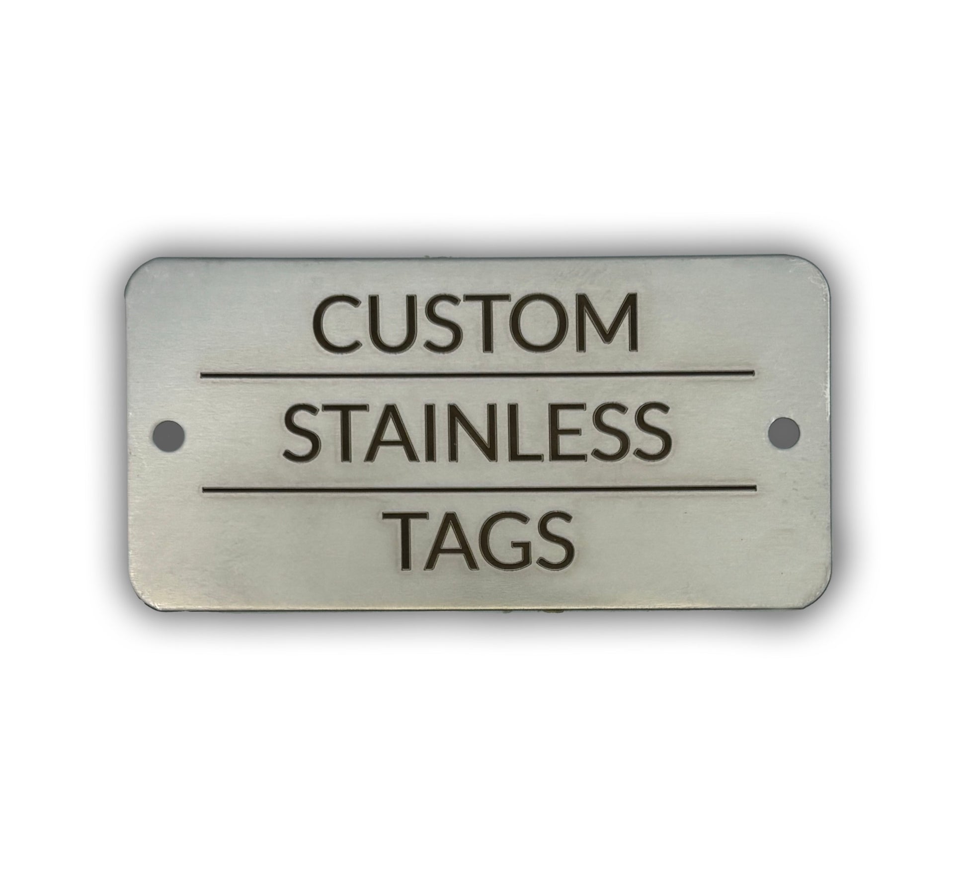A rectangular stainless steel tag with the text 'CUSTOM STAINLESS TAGS' engraved on it.