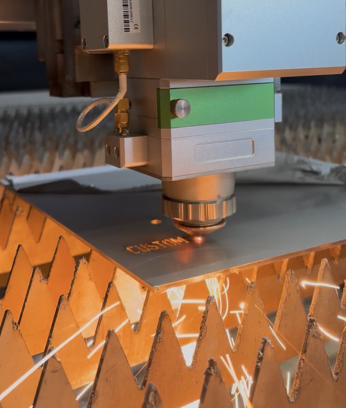 CNC machine cutting metal with sparks flying