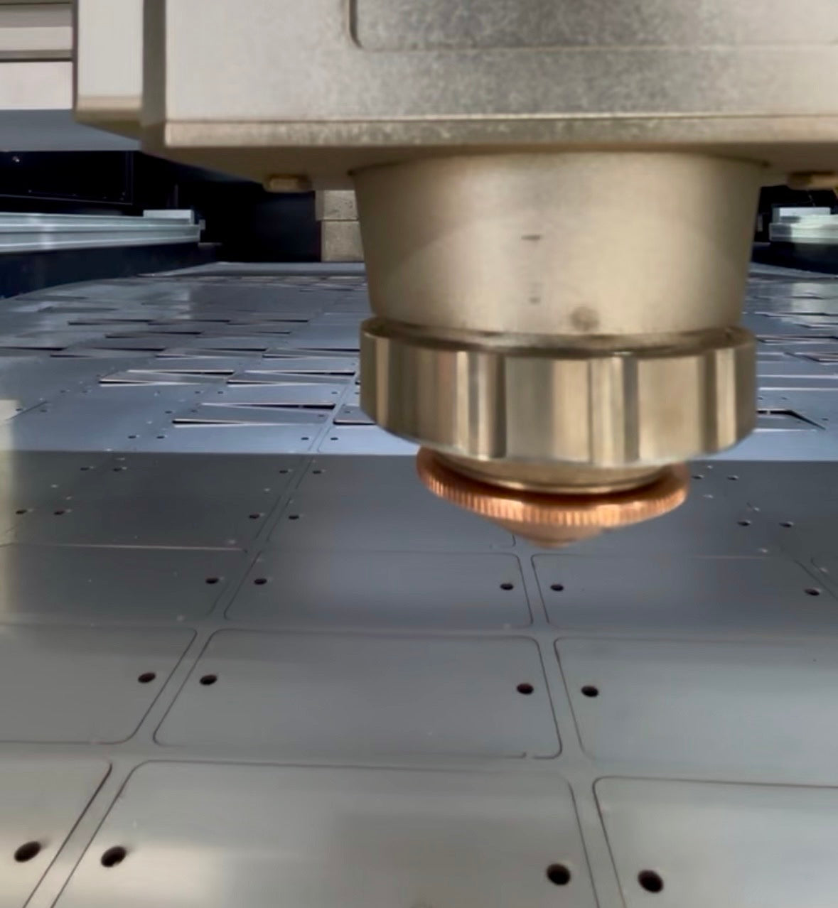 a sheet of custom metal tags cut by a fiber laser