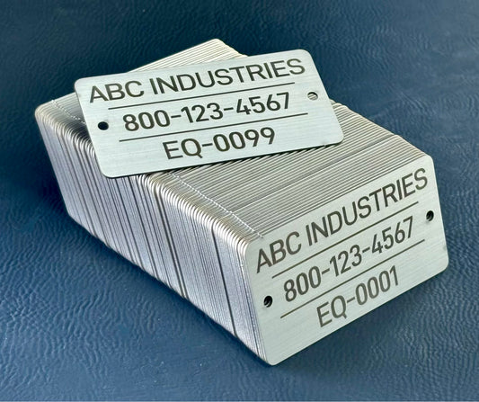 Sequencial numbered stack of metal tags with 'ABC Industries' branding and contact information on a blue background