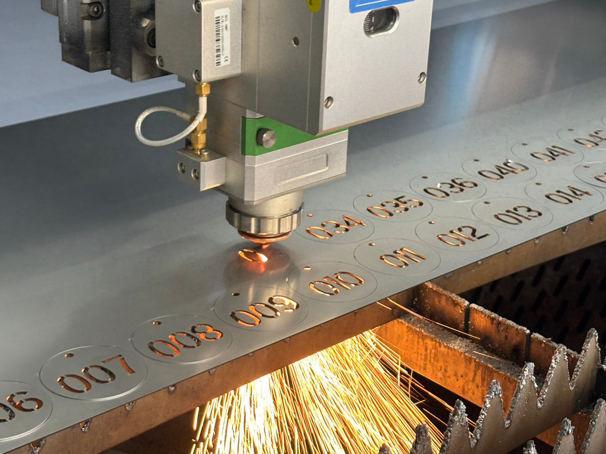 Fiber laser cutting sequential air cannon identification tags from 20-gauge stainless steel